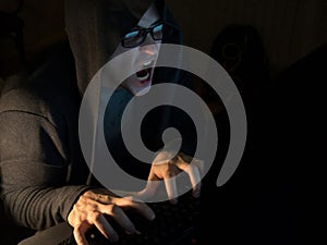 Computer hacker man stealing information with laptop