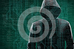 Computer hacker in mask and hoodie over abstract binary background. Obscured dark face. Data thief, internet fraud