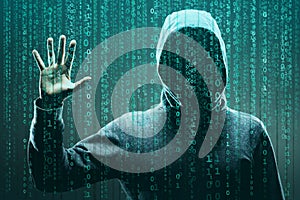 Computer hacker in mask and hoodie over abstract binary background. Obscured dark face. Data thief, internet fraud