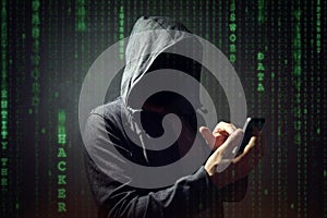 Computer hacker with mobile phone