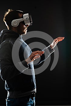 Computer hacker in virtual reality headset. Man in VR helmet. Data thief, internet fraud, darknet and cyber security