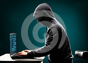 Computer hacker in white mask and hoodie. Obscured dark face. Data thief, internet fraud, darknet and cyber security