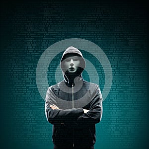 Computer hacker in white mask and hoodie. Obscured dark face. Data thief, internet fraud, darknet and cyber security