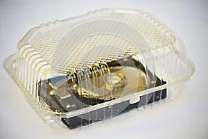 Computer hard disc into transparent plastic container