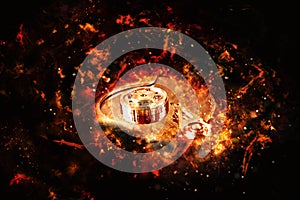 Computer hard disk on fire, burning in flames.