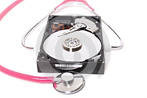 computer hard drive with pink stethoscope