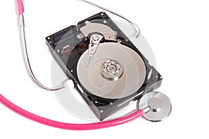 computer hard drive with pink stethoscope