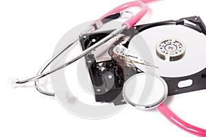 computer hard drive with pink stethoscope