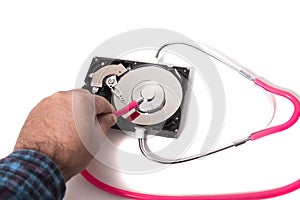 computer hard drive with pink stethoscope