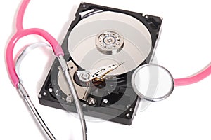 computer hard drive with pink stethoscope