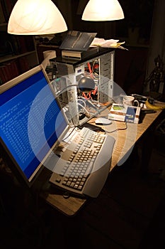 Computer hardware, cables or information technology on desk, code or programming in dark room. Desktop, pc and