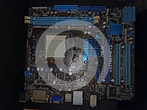 Computer Hardware. Motherboard, A close-up microchip with many electrical components placed on the Board