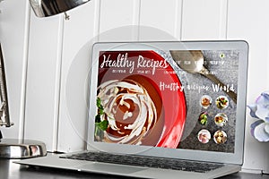 Computer, with healthy recipes blog on screen. web with nutritio