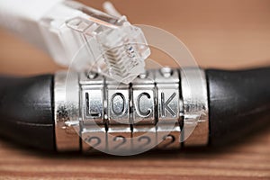 Computer internet cable and lock. Internet security concept. Internet cable and padlock with text LOCK