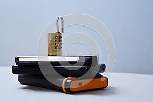 Computer or internet security. Data protection concept: external hard drive and lock
