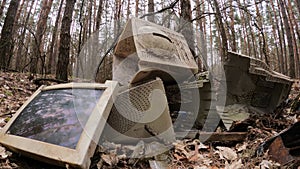 Computer in a junkyard in the forest