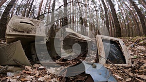 Computer in a junkyard in the forest