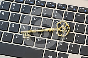 A Computer keyboard with an antique key.