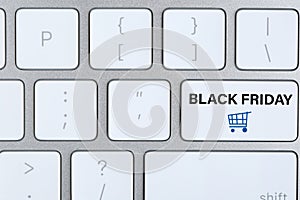 Computer keyboard with Black Friday button. Online shopping