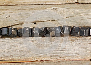 Computer keyboard buttons on old wood background,