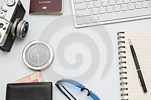 Computer keyboard with camera and notebook on white background