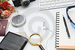 Computer keyboard with camera and notebook on white background