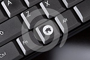 Computer keyboard close-up with home button