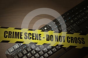 Computer keyboard with crime scene tape