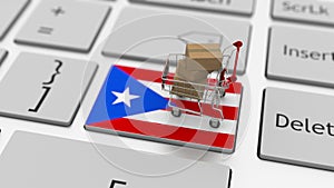 Computer keyboard key with flag of Puerto Rico and shopping cart with cartons, online shopping conceptual 3d rendering