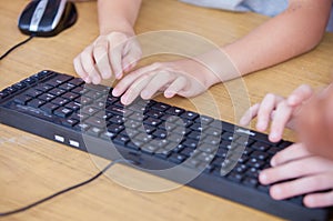 Computer keyboard with kids hands