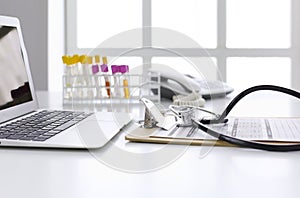 Computer keyboard, mouse and notebook with a pencil on the table