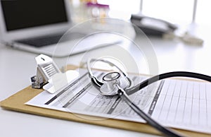 Computer keyboard, mouse and notebook with a pencil on the table