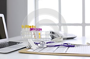 Computer keyboard, mouse and notebook with a pencil on the table