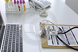 Computer keyboard, mouse and notebook with a pencil on the table