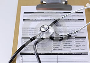 Computer keyboard, mouse and notebook with a pencil on the table
