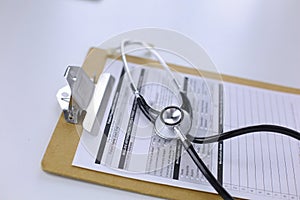 Computer keyboard, mouse and notebook with a pencil on the table
