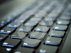 computer keyboard in the office illuminated by natural light