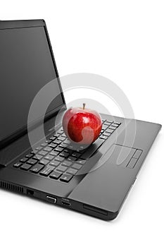 Computer Keyboard and red apple