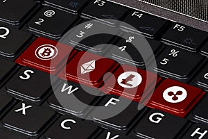 Computer keyboard with symbols of the most popular crypto currencies on the keys and color accent. Concept of cryptocurrency and