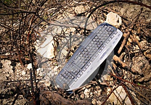 Computer keyboard in the trash