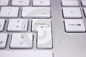 Computer keyboard with word concerning the school