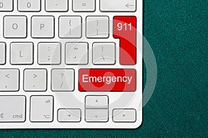 Computer keyboard with word emergency and number 911