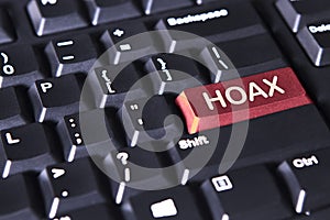 Computer keyboard with word of hoax