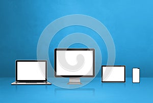 Computer, laptop, mobile phone and digital tablet pc. blue background