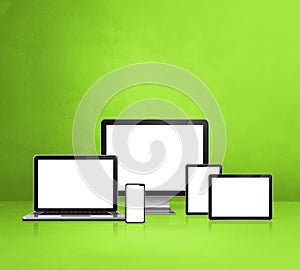 Computer, laptop, mobile phone and digital tablet pc. green background