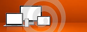 Computer, laptop, mobile phone and digital tablet pc. orange banner