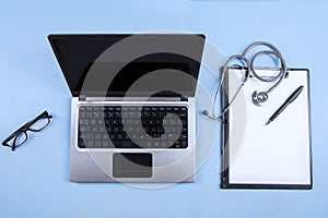 Computer laptop, stethoscope and clipboard 1