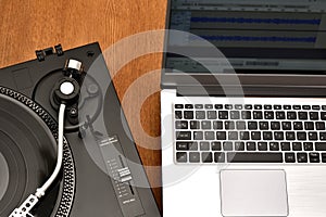 Computer laptop and turntable for digitizing vinyl records.