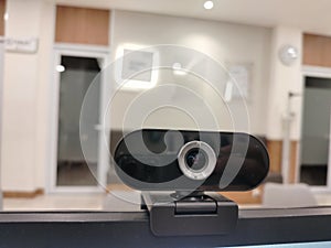a computer or laptop webcam that is attached to the computer screen