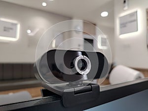 a computer or laptop webcam that is attached to the computer screen